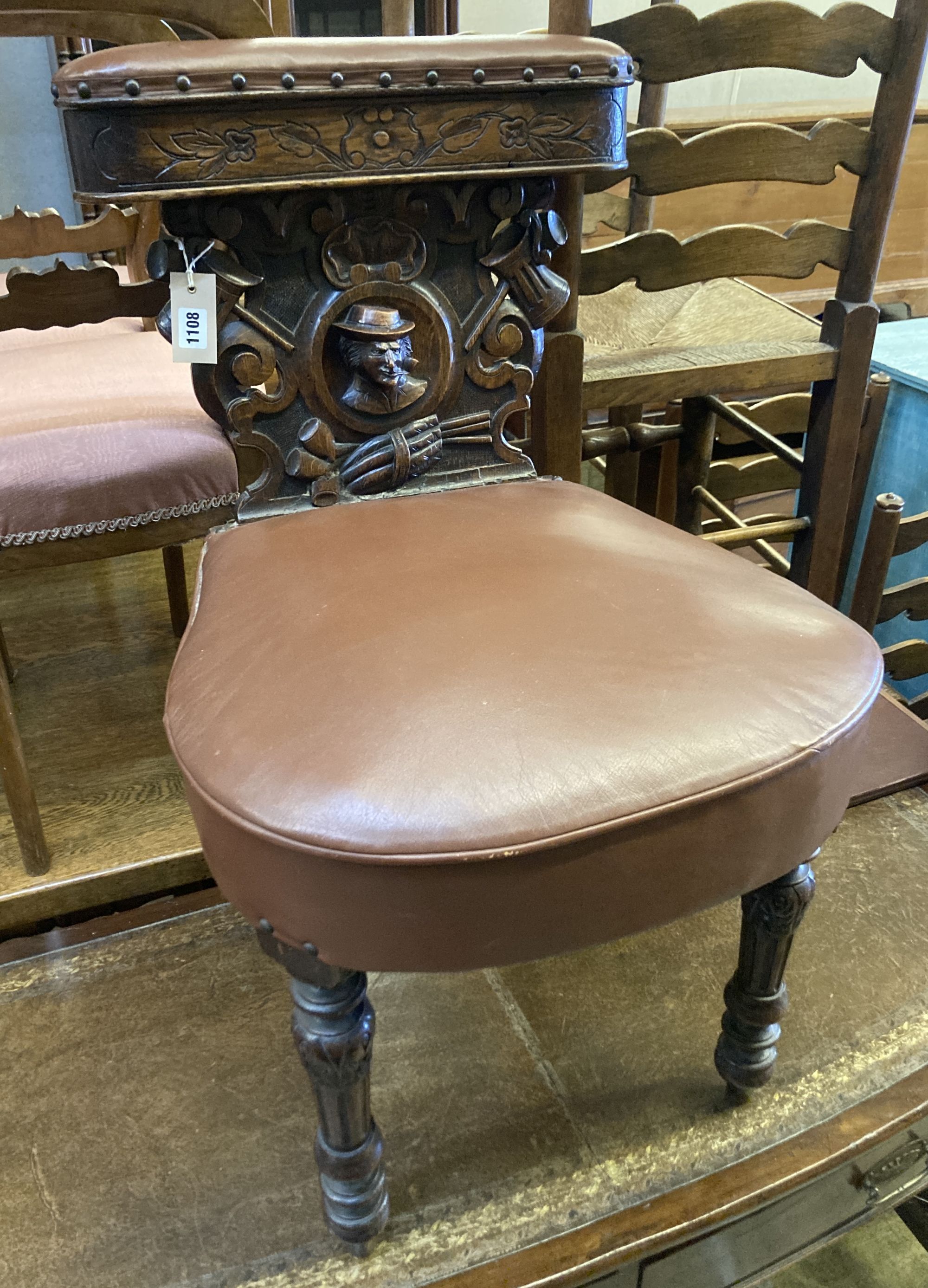 A 19th century Flemish carved oak prie dieu chair, width 48cm, depth 50cm, height 80cm